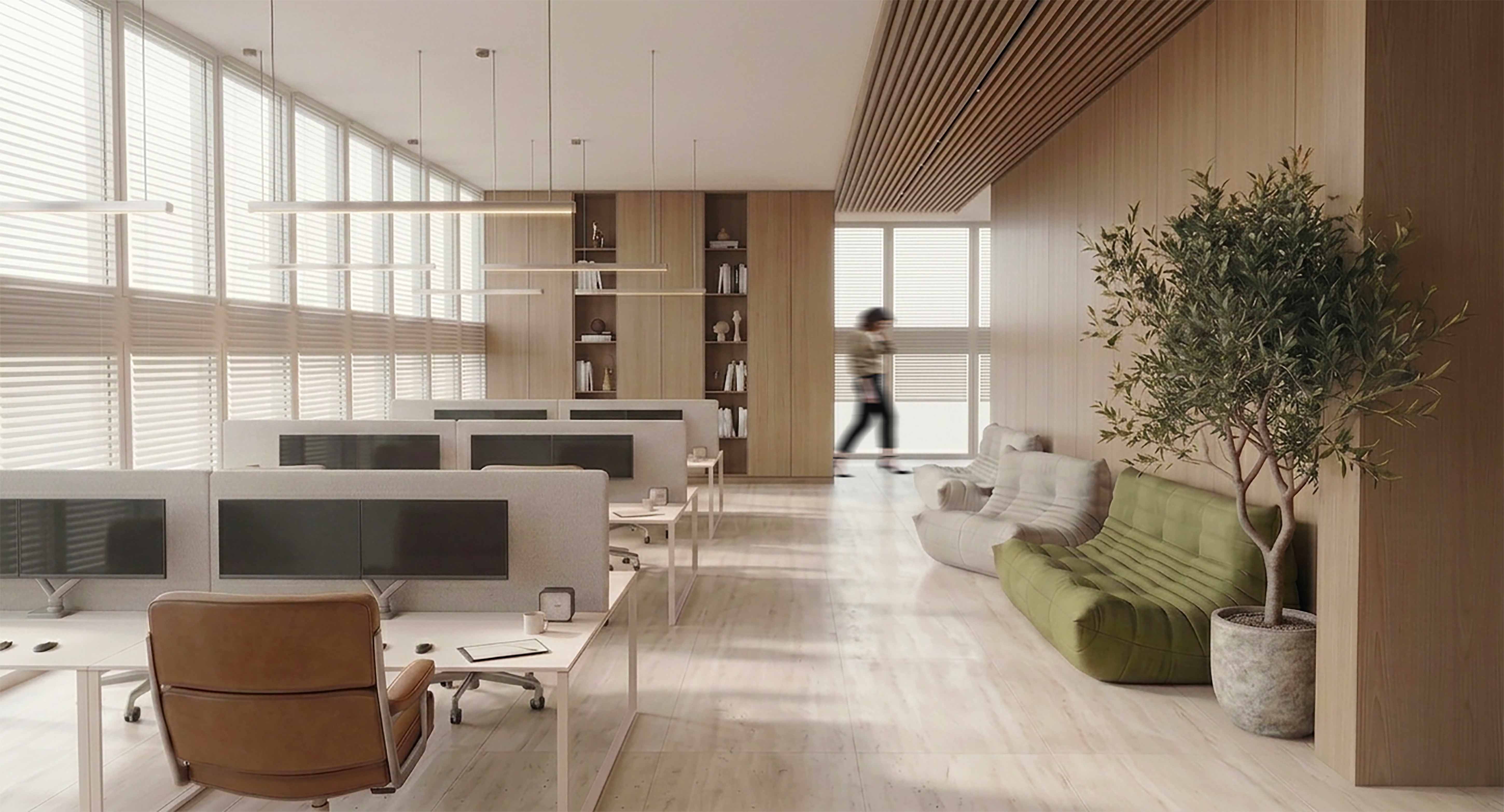 Open plan office with wood-paneled lounge area and desks